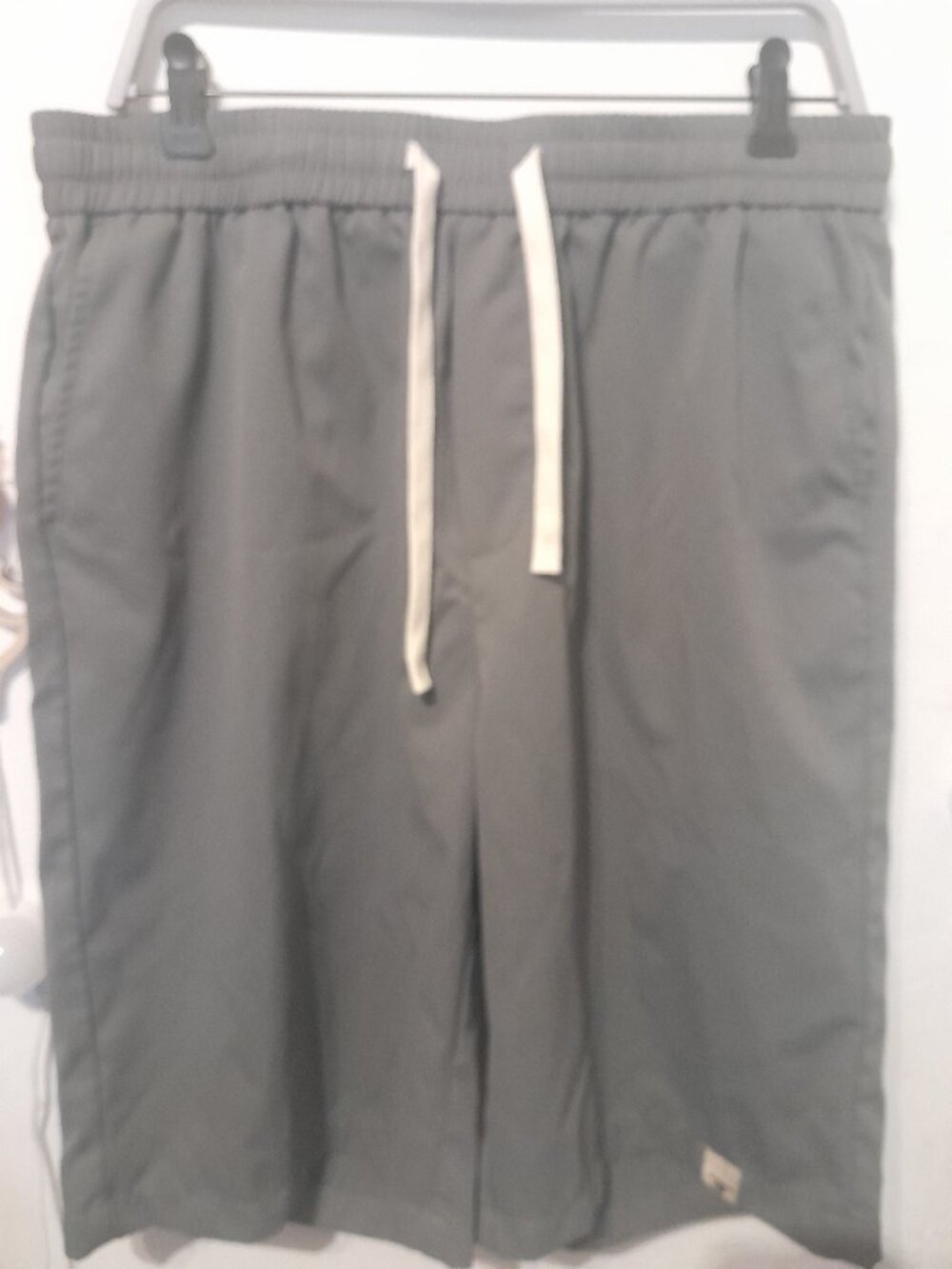 gray elastic drawstring shorts featuring a white waist cord